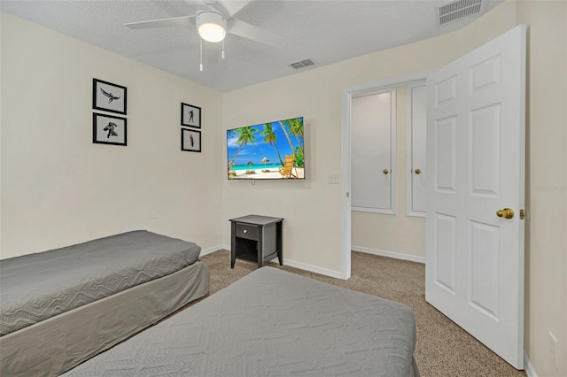 8622 La Isla Dr, Kissimmee, FL 34747 - bedroom with carpet, baseboards, a textured ceiling, and ceiling fan