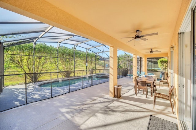 8622 La Isla Dr, Kissimmee, FL 34747 - view of patio with a pool with connected hot tub, a ceiling fan, a lanai, and outdoor dining area