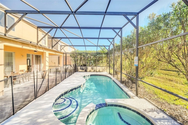 8622 La Isla Dr, Kissimmee, FL 34747 - view of pool featuring a patio, a pool with connected hot tub, a lanai, and a ceiling fan