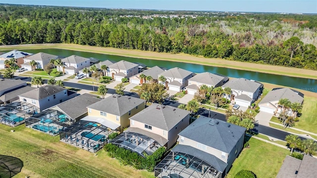 8622 La Isla Dr, Kissimmee, FL 34747 - aerial perspective of suburban area with a heavily wooded area and a nearby body of water