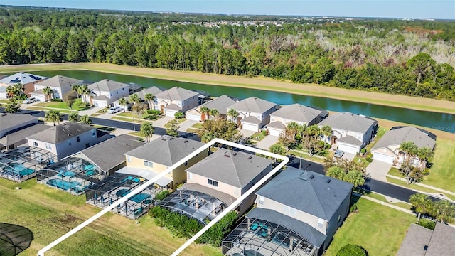 8622 La Isla Dr, Kissimmee, FL 34747 - aerial perspective of suburban area with a forest and a nearby body of water