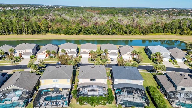 8622 La Isla Dr, Kissimmee, FL 34747 - aerial perspective of suburban area featuring a heavily wooded area and a large body of water