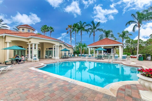 8622 La Isla Dr, Kissimmee, FL 34747 - community pool featuring a patio area and a gazebo