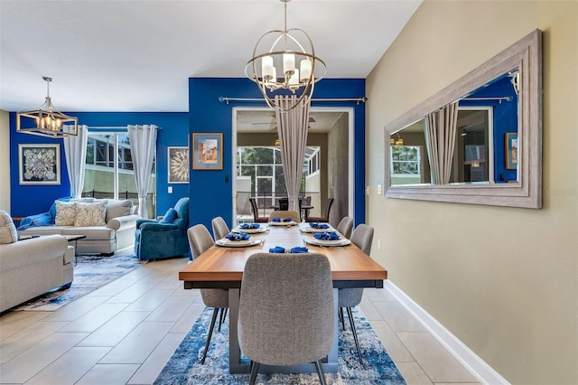 424 Ocean Course Ave, Davenport, FL 33896 - dining room featuring a chandelier and tile patterned flooring