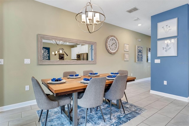 424 Ocean Course Ave, Davenport, FL 33896 - dining area featuring a chandelier, light tile patterned floors, and recessed lighting