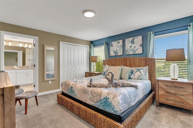 424 Ocean Course Ave, Davenport, FL 33896 - bedroom with light colored carpet, a closet, and connected bathroom