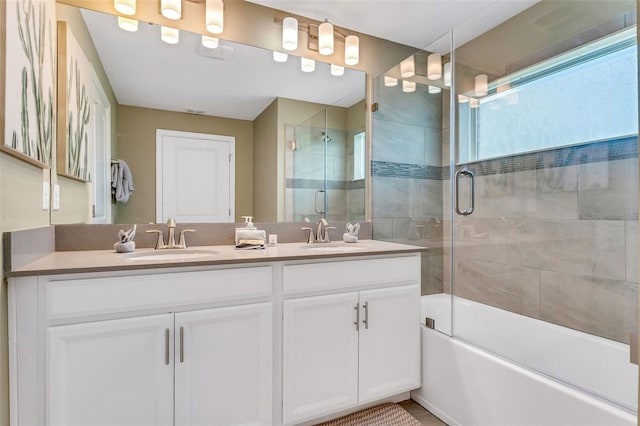 424 Ocean Course Ave, Davenport, FL 33896 - full bathroom with double vanity and combined bath / shower with glass door