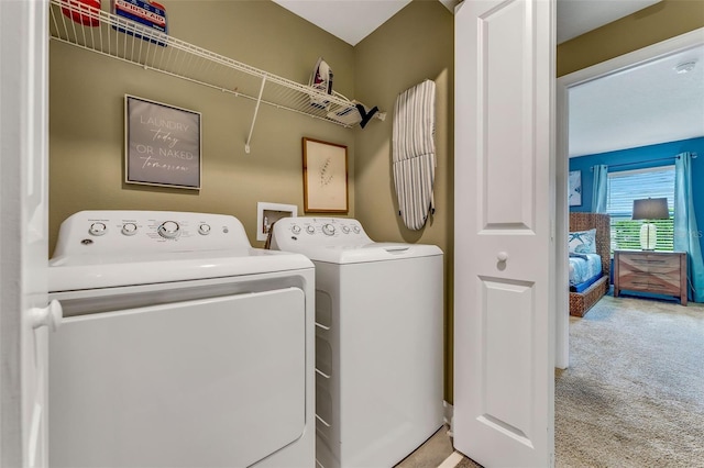 424 Ocean Course Ave, Davenport, FL 33896 - washroom with washing machine and clothes dryer and carpet floors