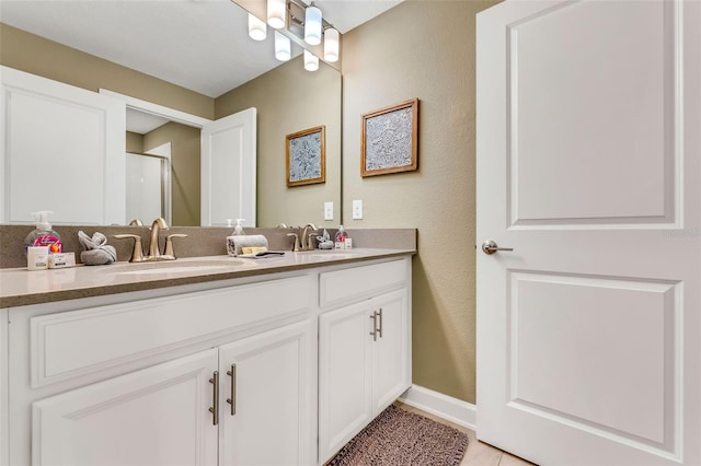 424 Ocean Course Ave, Davenport, FL 33896 - bathroom featuring double vanity, an enclosed shower, and tile patterned flooring