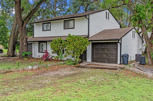 131 Stefanik Rd, Winter Park, FL 32792 - view of front of house featuring a garage, cooling unit, and a shingled roof
