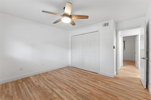 131 Stefanik Rd, Winter Park, FL 32792 - unfurnished bedroom featuring light wood finished floors, baseboards, a closet, and a ceiling fan