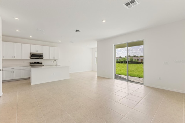 797 Lemon Ave, Fruitland Park, FL 34731 - unfurnished living room featuring a sink, light tile patterned floors, recessed lighting, and baseboards