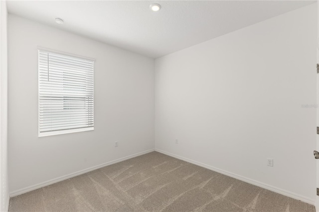 797 Lemon Ave, Fruitland Park, FL 34731 - unfurnished room with light carpet and baseboards