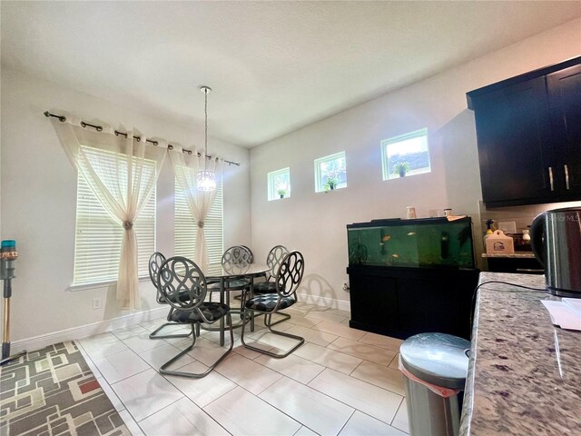 16611 Toccoa Row, Winter Garden, FL 34787 - dining area featuring baseboards