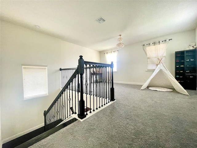 16611 Toccoa Row, Winter Garden, FL 34787 - staircase with a chandelier and carpet flooring