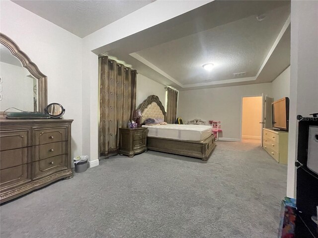 16611 Toccoa Row, Winter Garden, FL 34787 - carpeted bedroom with a tray ceiling and baseboards