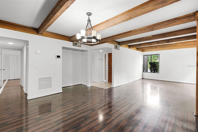 5301 Burning Tree Dr Unit F, Orlando, FL 32811 - unfurnished room featuring a chandelier, wood finished floors, beamed ceiling, and recessed lighting