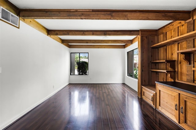 5301 Burning Tree Dr Unit F, Orlando, FL 32811 - unfurnished living room featuring beam ceiling and dark wood finished floors