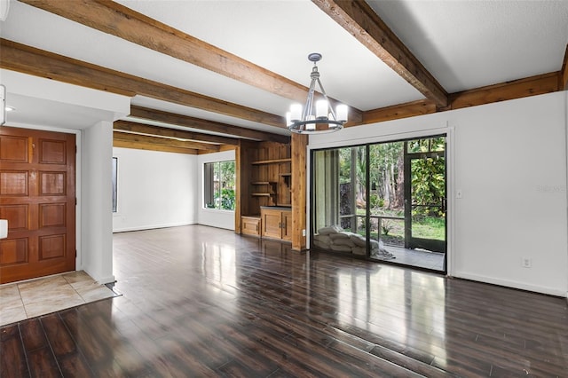 5301 Burning Tree Dr Unit F, Orlando, FL 32811 - unfurnished living room featuring a chandelier, beamed ceiling, and wood finished floors