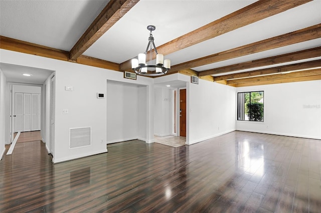 5301 Burning Tree Dr Unit F, Orlando, FL 32811 - unfurnished living room featuring a chandelier, wood finished floors, and beamed ceiling