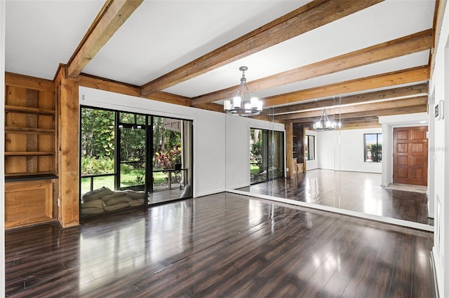 5301 Burning Tree Dr Unit F, Orlando, FL 32811 - unfurnished living room with a chandelier, wood finished floors, beam ceiling, and built in shelves