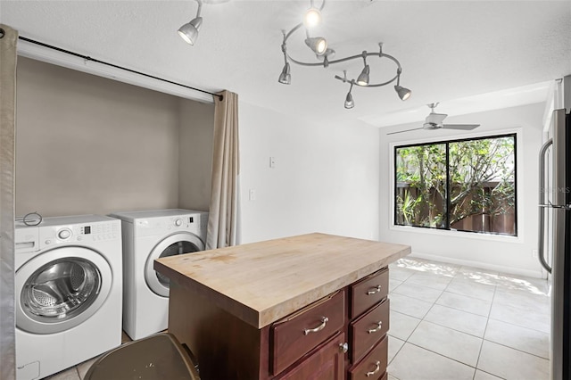 5301 Burning Tree Dr Unit F, Orlando, FL 32811 - washroom with independent washer and dryer, ceiling fan, and light tile patterned floors