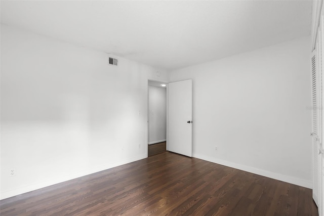 5301 Burning Tree Dr Unit F, Orlando, FL 32811 - unfurnished bedroom with wood finished floors and baseboards
