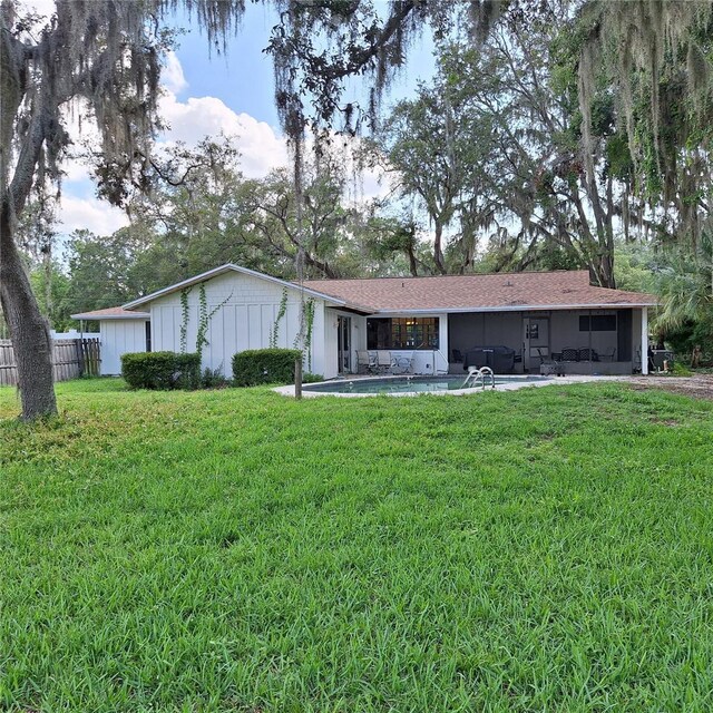 10012 Lake Louisa Rd, Clermont, FL 34711 - ranch-style home with a sunroom and board and batten siding