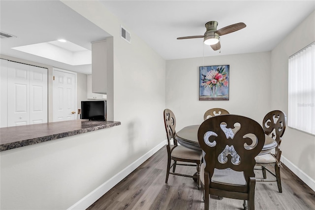 9900 Sweepstakes Ln Unit 1, Orlando, FL 32837 - dining space featuring baseboards, wood finished floors, and ceiling fan