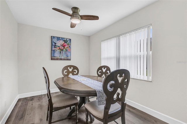 9900 Sweepstakes Ln Unit 1, Orlando, FL 32837 - dining room with baseboards, ceiling fan, and wood finished floors