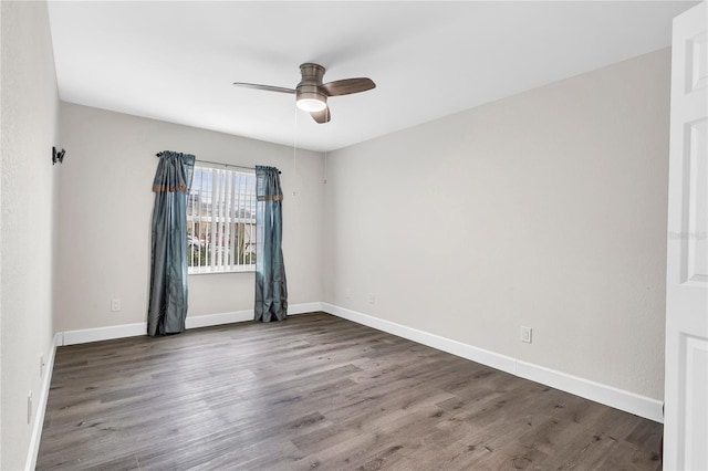 9900 Sweepstakes Ln Unit 1, Orlando, FL 32837 - unfurnished room with a ceiling fan, wood finished floors, and baseboards