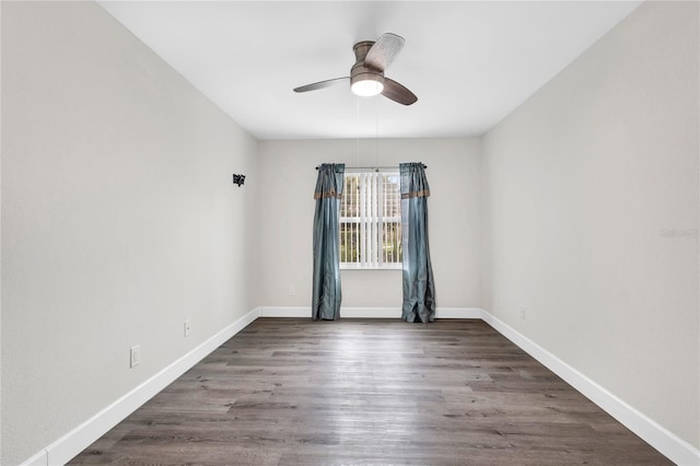 9900 Sweepstakes Ln Unit 1, Orlando, FL 32837 - unfurnished room featuring a ceiling fan, dark wood-style flooring, and baseboards