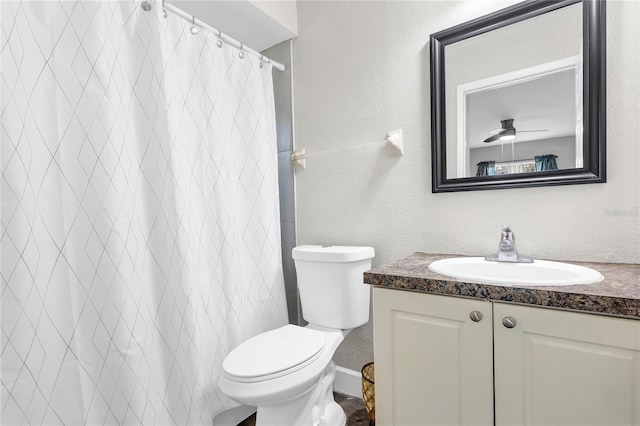 9900 Sweepstakes Ln Unit 1, Orlando, FL 32837 - bathroom featuring vanity, toilet, a textured wall, and a shower with shower curtain