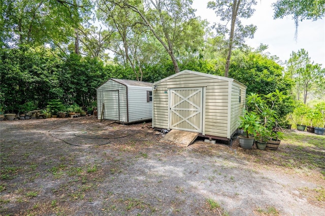 1550 Kevin Ln, Deland, FL 32724 - view of shed with view of wooded area