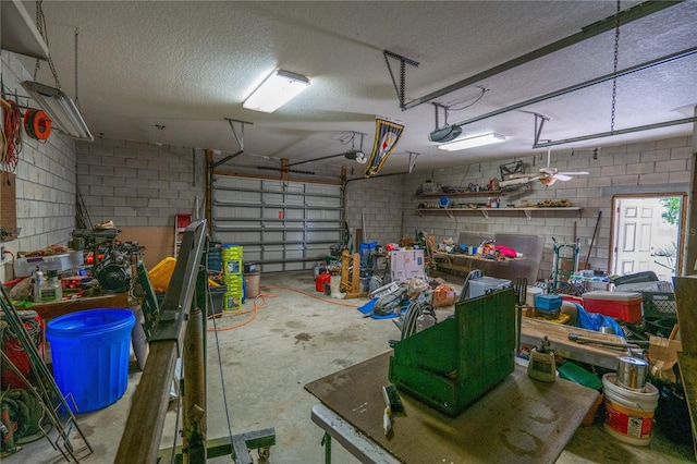 1550 Kevin Ln, Deland, FL 32724 - garage featuring a garage door opener and concrete block wall