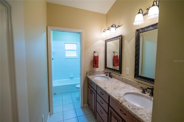 1550 Kevin Ln, Deland, FL 32724 - bathroom featuring toilet, double vanity, and tile patterned floors
