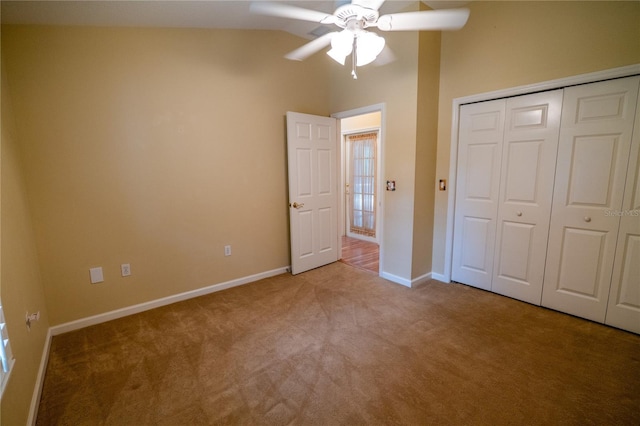 1550 Kevin Ln, Deland, FL 32724 - unfurnished bedroom with carpet floors, baseboards, vaulted ceiling, a closet, and ceiling fan