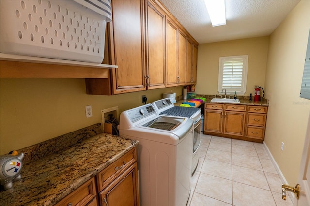 1550 Kevin Ln, Deland, FL 32724 - washroom featuring independent washer and dryer, cabinet space, and light tile patterned floors