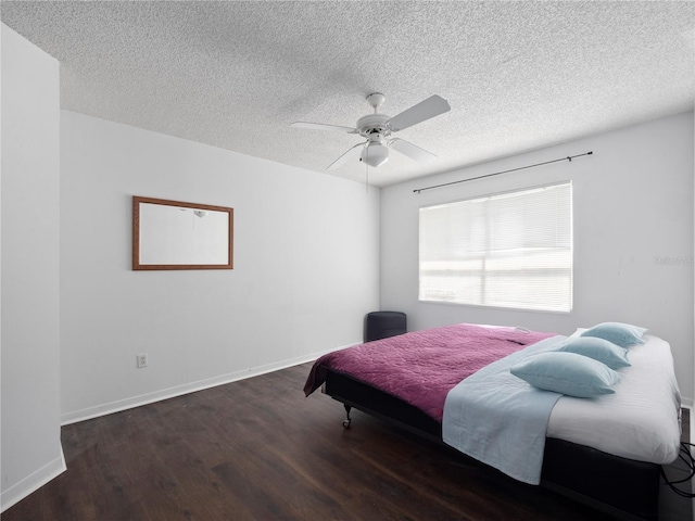 2533 Grassy Point Dr Unit 215, Lake Mary, FL 32746 - bedroom featuring wood finished floors, a textured ceiling, ceiling fan, and baseboards