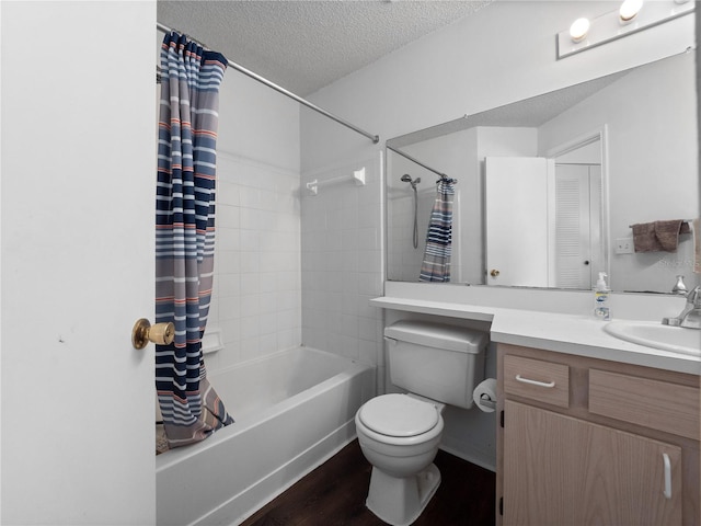 2533 Grassy Point Dr Unit 215, Lake Mary, FL 32746 - bathroom featuring shower / tub combo with curtain, vanity, a textured ceiling, toilet, and wood finished floors