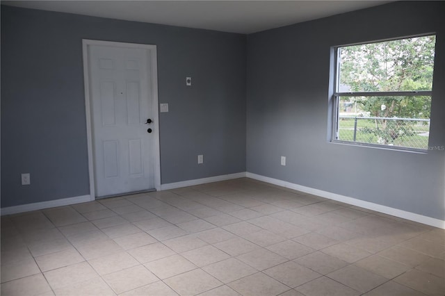 102 Luna Rd, Auburndale, FL 33823 - spare room featuring baseboards and light tile patterned flooring