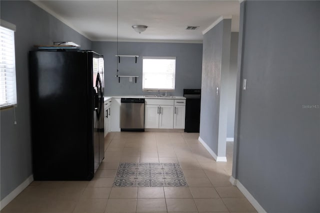 102 Luna Rd, Auburndale, FL 33823 - kitchen featuring black fridge with ice dispenser, dishwasher, white cabinetry, light countertops, and stove