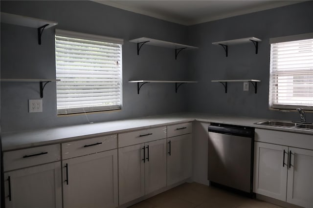 102 Luna Rd, Auburndale, FL 33823 - kitchen featuring stainless steel dishwasher, open shelves, white cabinets, light countertops, and light tile patterned floors