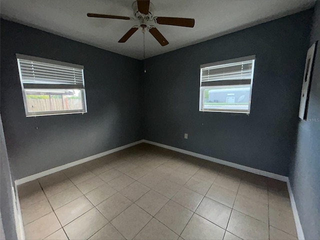 102 Luna Rd, Auburndale, FL 33823 - spare room featuring healthy amount of natural light, a ceiling fan, and tile patterned floors