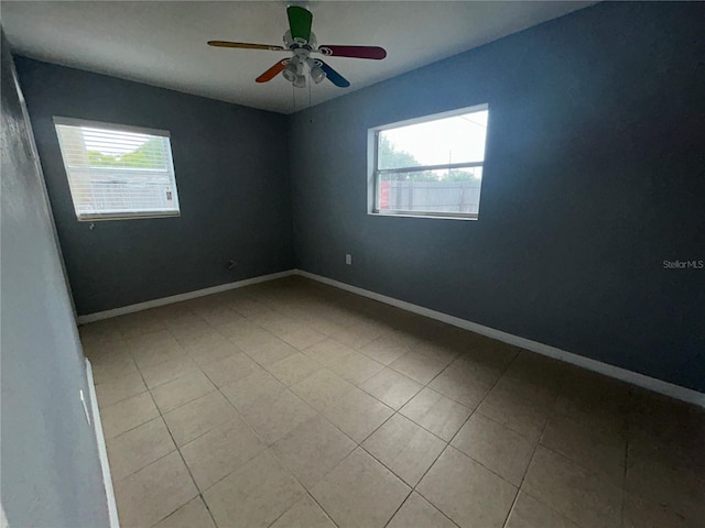102 Luna Rd, Auburndale, FL 33823 - tiled spare room featuring healthy amount of natural light and a ceiling fan