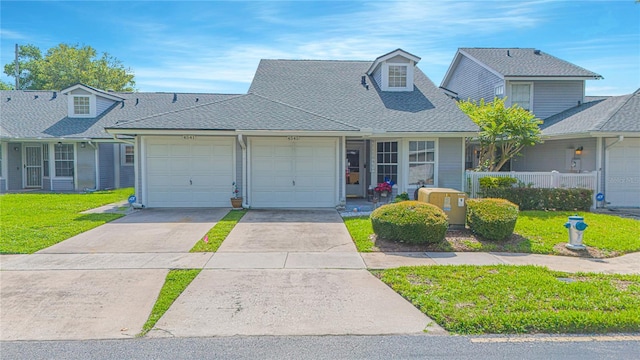 4545 Southfield Ave, Orlando, FL 32812 - view of front of property with a shingled roof, a front lawn, a garage, and driveway