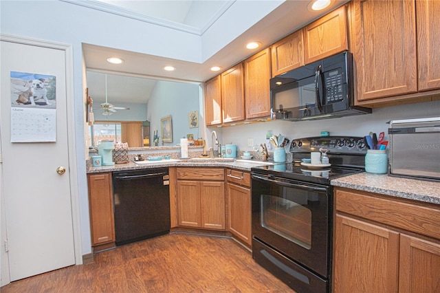 4545 Southfield Ave, Orlando, FL 32812 - kitchen featuring black appliances, dark wood-type flooring, recessed lighting, a ceiling fan, and brown cabinets