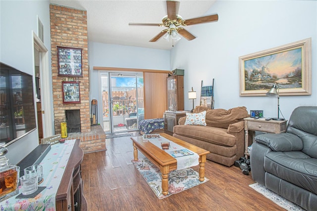 4545 Southfield Ave, Orlando, FL 32812 - living room with a ceiling fan, wood finished floors, and a fireplace