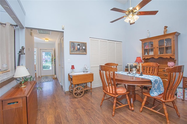 4545 Southfield Ave, Orlando, FL 32812 - dining space featuring wood finished floors, a ceiling fan, and a towering ceiling