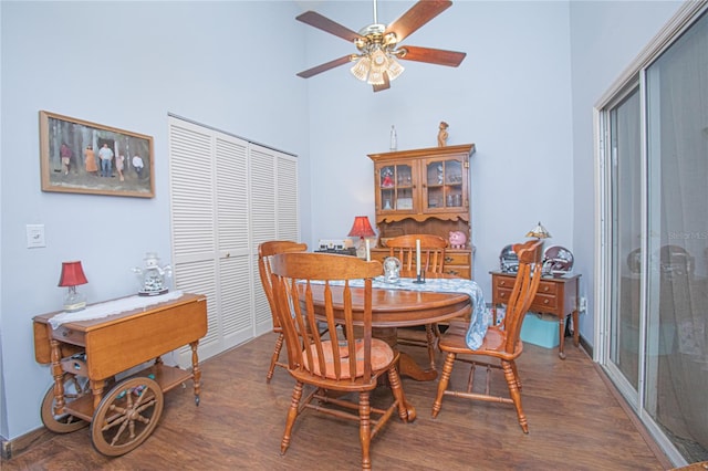 4545 Southfield Ave, Orlando, FL 32812 - dining area featuring wood finished floors, ceiling fan, and a towering ceiling